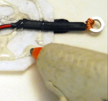 Final Assembly: Applying glue from gluegun to felt